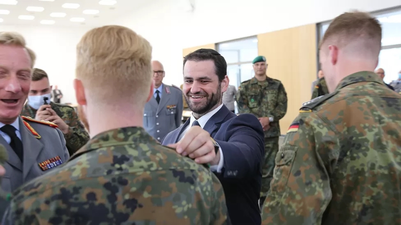 Zsolt Balla (centre) meets soldiers in Germany